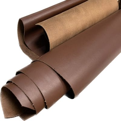 The Europa Bitter Chocolate cow leather has exceptional durability and longevity. The full-grain cowhide leather, sourced exclusively from the side of the cow, is impressively thick at 3/4 oz. (1.2-1.4mm) and has undergone chrome tannage, resulting in a soft to medium temper. These hides typically measure 16-18 sq. ft. and are sourced from Mexico. This Leather is suitable for a variety of products, including handbags, belts, shoes, straps, and accessories.