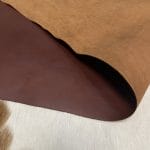 The Europa Brown Stone cow leather has exceptional durability and longevity. The full-grain cowhide leather, sourced exclusively from the side of the cow, is impressively thick at 3/4 oz. (1.2-1.4mm) and has undergone chrome tannage, resulting in a soft to medium temper. These hides typically measure 16-18 sq. ft. and are sourced from Mexico. This Leather is suitable for a variety of products, including handbags, belts, shoes, straps, and accessories.