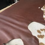 The Europa Brown Stone cow leather has exceptional durability and longevity. The full-grain cowhide leather, sourced exclusively from the side of the cow, is impressively thick at 3/4 oz. (1.2-1.4mm) and has undergone chrome tannage, resulting in a soft to medium temper. These hides typically measure 16-18 sq. ft. and are sourced from Mexico. This Leather is suitable for a variety of products, including handbags, belts, shoes, straps, and accessories.