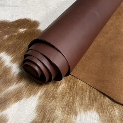 The Europa Brown Stone cow leather has exceptional durability and longevity. The full-grain cowhide leather, sourced exclusively from the side of the cow, is impressively thick at 3/4 oz. (1.2-1.4mm) and has undergone chrome tannage, resulting in a soft to medium temper. These hides typically measure 16-18 sq. ft. and are sourced from Mexico. This Leather is suitable for a variety of products, including handbags, belts, shoes, straps, and accessories.