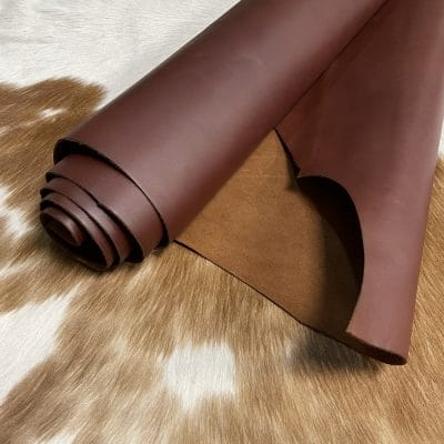 The Europa Brown Stone cow leather has exceptional durability and longevity. The full-grain cowhide leather, sourced exclusively from the side of the cow, is impressively thick at 3/4 oz. (1.2-1.4mm) and has undergone chrome tannage, resulting in a soft to medium temper. These hides typically measure 16-18 sq. ft. and are sourced from Mexico. This Leather is suitable for a variety of products, including handbags, belts, shoes, straps, and accessories.