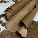The Europa cow leather has exceptional durability and longevity. The full-grain cowhide, sourced exclusively from the side of the cow, is impressively thick at 3/4 oz. (1.2-1.4mm) and has undergone chrome tannage, resulting in a soft to medium temper. These hides typically measure 16-18 sq. ft. and are sourced from Mexico. This Leather is suitable for a variety of products, including handbags, belts, shoes, straps, and accessories.