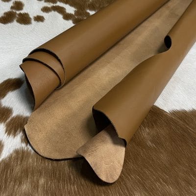The Europa cow leather has exceptional durability and longevity. The full-grain cowhide, sourced exclusively from the side of the cow, is impressively thick at 3/4 oz. (1.2-1.4mm) and has undergone chrome tannage, resulting in a soft to medium temper. These hides typically measure 16-18 sq. ft. and are sourced from Mexico. This Leather is suitable for a variety of products, including handbags, belts, shoes, straps, and accessories.