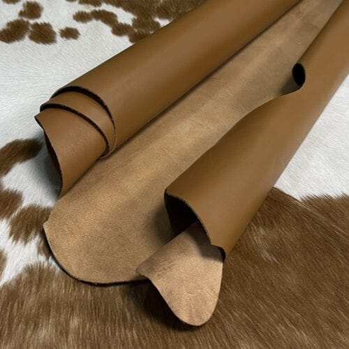 The Europa cow leather has exceptional durability and longevity. The full-grain cowhide, sourced exclusively from the side of the cow, is impressively thick at 3/4 oz. (1.2-1.4mm) and has undergone chrome tannage, resulting in a soft to medium temper. These hides typically measure 16-18 sq. ft. and are sourced from Mexico. This Leather is suitable for a variety of products, including handbags, belts, shoes, straps, and accessories.