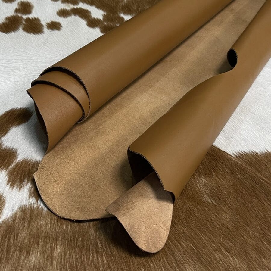 The Europa cow leather has exceptional durability and longevity. The full-grain cowhide, sourced exclusively from the side of the cow, is impressively thick at 3/4 oz. (1.2-1.4mm) and has undergone chrome tannage, resulting in a soft to medium temper. These hides typically measure 16-18 sq. ft. and are sourced from Mexico. This Leather is suitable for a variety of products, including handbags, belts, shoes, straps, and accessories.