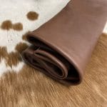 The Hudson Cow Leather Collection showcases exquisite cowhide items crafted from top-quality full-grain leather. These products are highly durable and built to last. With a timeless and exquisite appearance, the leather boasts a natural grain texture and is 1.0-1.2 mm thick. Its medium-soft temper feels silky smooth against the skin. These versatile products can be used for hats, wallets, handbags, shoes, accessories, and apparel. Every hide is approximately 18-20 sq. ft. and has a sleek chrome finish.