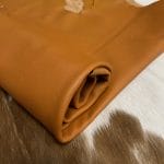 The Hudson Cow Leather Collection showcases exquisite cowhide items crafted from top-quality full-grain leather. These products are highly durable and built to last. With a timeless and exquisite appearance, the leather boasts a natural grain texture and is 1.0-1.2 mm thick. Its medium-soft temper feels silky smooth against the skin. These versatile products can be used for hats, wallets, handbags, shoes, accessories, and apparel. Every hide is approximately 18-20 sq. ft. and has a sleek chrome finish.