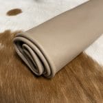 The Hudson Cow Leather Collection showcases exquisite cowhide items crafted from top-quality full-grain leather. These products are highly durable and built to last. With a timeless and exquisite appearance, the leather boasts a natural grain texture and is 1.0-1.2 mm thick. Its medium-soft temper feels silky smooth against the skin. These versatile products can be used for hats, wallets, handbags, shoes, accessories, and apparel. Every hide is approximately 18-20 sq. ft. and has a sleek chrome finish.