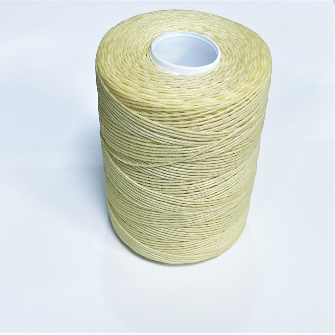 TI1000-09 Ivory (2) Avetco Brand offers a wax-coated polyester thread that is shiny, soft, and highly resistant to high temperatures, humidity, mildew, and water. This thread is perfect for hand-sewing, crafting, and manufacturing a wide range of products such as footwear, sofas, car seats, sports equipment, furniture, and canvas items. It is a versatile material that is durable and reliable, ensuring long-lasting results. Each spool contains 250 grams of thread that is made from 100% polyester waxed material and has a length of approximately 400m/433 yards. The thickness of the thread is 0.76mm.