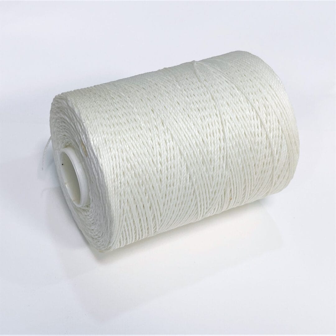 TI1000-2 White (2) Avetco Brand offers a wax-coated polyester thread that is shiny, soft, and highly resistant to high temperatures, humidity, mildew, and water. This thread is perfect for hand-sewing, crafting, and manufacturing a wide range of products such as footwear, sofas, car seats, sports equipment, furniture, and canvas items. It is a versatile material that is durable and reliable, ensuring long-lasting results. Each spool contains 250 grams of thread that is made from 100% polyester waxed material and has a length of approximately 400m/433 yards. The thickness of the thread is 0.76mm.