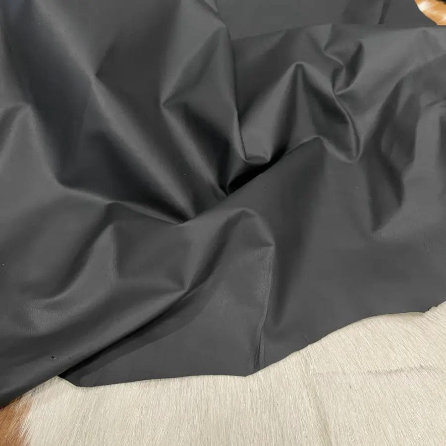 This high-quality lambskin garment leather is made from 100% British lambskin, renowned for its soft and supple texture. The leather is expertly tanned using the chrome tanning process, which results in a durable and long-lasting product that will wear beautifully over time. The leather is available in a full hide size of 5-7 sq. ft. and has a full-grain finish, which means that it retains the natural texture and markings of the original hide. The thickness of the leather is 1 oz, which equates to a range of 0.4-0.6 mm. The leather is sourced from Turkey, where it undergoes rigorous quality control procedures to ensure that it meets the highest standards. The resulting product is a premium-grade leather that is perfect for creating luxurious garments and accessories that will stand the test of time.