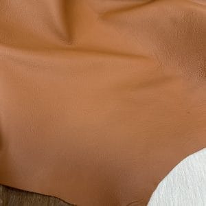 The Lambskin Leather Collection is a testament to the beauty of nature and the art of leather crafting. Made from high-quality full-grain leather with a semi-veg finish, this collection exudes an authentic and naturally worn appearance that is both timeless and luxurious. The smooth and silky texture of the leather provides a comfortable and stylish option for creating handbags, shoes, garments, and accessories.