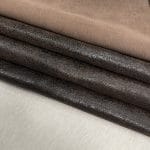The Oklahoma collection leather is not just about its unique crackle finish and vintage look. It's also a testament to durability. Crafted from chrome-tanned heifer hide, it's been dyed-through to create a soft, suede base with a shiny wax transfer on top. This gives the leather a vintage, yet timeless look that's perfect for a variety of uses, including accessories like handbags, wallets, belts, and footwear. Its textured and strong appearance is a clear indication of its durability, making it an excellent choice for apparel and trim. The leather has an aniline finishing which gives it a rugged appearance. It is available in a weight of 3 oz. (1.2-1.4 mm) and has an average hide size of 22-25 Sq. Ft. It is tanned in Mexico and has a soft temper with a dull shine. We understand that the measurements of the leather can vary, and we want to assure you that your order is an estimate. The final cost will be determined once the hide is ready to ship. You will be refunded the difference if the leather is smaller than specified. This way, you can feel secure in your purchase and confident that you're getting the best value for your money.