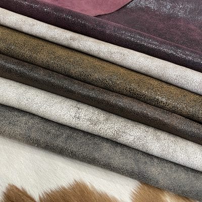 The Oklahoma collection leather is not just about its unique crackle finish and vintage look. It's also a testament to durability. Crafted from chrome-tanned heifer hide, it's been dyed-through to create a soft, suede base with a shiny wax transfer on top. This gives the leather a vintage, yet timeless look that's perfect for a variety of uses, including accessories like handbags, wallets, belts, and footwear. Its textured and strong appearance is a clear indication of its durability, making it an excellent choice for apparel and trim. The leather has an aniline finishing which gives it a rugged appearance. It is available in a weight of 3 oz. (1.2-1.4 mm) and has an average hide size of 22-25 Sq. Ft. It is tanned in Mexico and has a soft temper with a dull shine. We understand that the measurements of the leather can vary, and we want to assure you that your order is an estimate. The final cost will be determined once the hide is ready to ship. You will be refunded the difference if the leather is smaller than specified. This way, you can feel secure in your purchase and confident that you're getting the best value for your money.