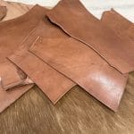 You will receive 5 pound of vegetable-tanned full-grain scrap tooling leather. This natural veg-tanned leather is perfect for smaller projects and is 100% vegetable-tanned. It is suitable for use in jewelry making, altered art, wallets, portraits, handbags, clutches, holsters, knife sheaths, and key fobs.