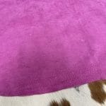 Economy Pig Suede Leather offers a unique, distinct look with characteristics that do not affect its performance. It may have uneven shade tones, dark spots, scarring, and a few holes, giving it an individualized appearance. This soft leather is made from swine raw material, weighing 2 oz. (0.6-0.8 mm) and is available in whole-hide specification. Despite minor blemishes and/or holes, it provides a soft and luxurious texture. With an average hide size of 3-9 sq. ft., it is suitable for lining in accessories, arts and crafts, bookbinding, shoes, and small leather goods.
