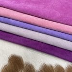 pink purple 3 | Avetco Leather Hides and Eva Foam Economy Pig Suede Leather offers a unique, distinct look with characteristics that do not affect its performance. It may have uneven shade tones, dark spots, scarring, and a few holes, giving it an individualized appearance. This soft leather is made from swine raw material, weighing 2 oz. (0.6-0.8 mm) and is available in whole-hide specification. Despite minor blemishes and/or holes, it provides a soft and luxurious texture. With an average hide size of 3-9 sq. ft., it is suitable for lining in accessories, arts and crafts, bookbinding, shoes, and small leather goods.