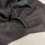 Our Montana Lambskin features a unique distressed look with a blend of earthy tones, including red, brown, black, and cognac. Its soft texture and rugged finish make it perfect for fashion pieces that need a worn-in, vintage appeal. Ideal for high-end accessories, garments, and décor, this leather offers both style and durability.
