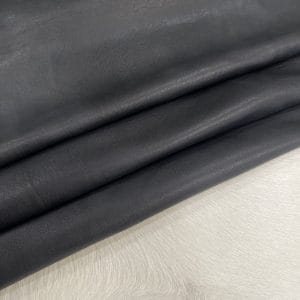 Florence lambskin leather with an aniline finish, showcasing natural blemishes and rich character through transparent dyes for a raw, authentic look.