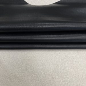 Heritage Goatskin Leather features a silky smooth texture and a refined finish. Available in rich shades of red, black, green, and purple, it offers durability and versatility for bold, sophisticated designs.