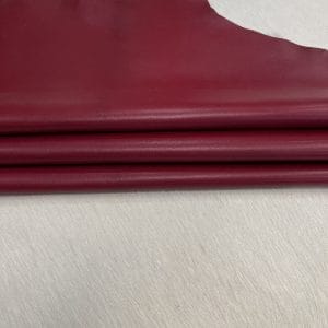 Heritage Goatskin Leather features a silky smooth texture and a refined finish. Available in rich shades of red, black, green, and purple, it offers durability and versatility for bold, sophisticated designs.
