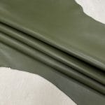 Heritage Goatskin Leather features a silky smooth texture and a refined finish. Available in rich shades of red, black, green, and purple, it offers durability and versatility for bold, sophisticated designs.