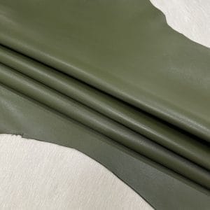 Heritage Goatskin Leather features a silky smooth texture and a refined finish. Available in rich shades of red, black, green, and purple, it offers durability and versatility for bold, sophisticated designs.