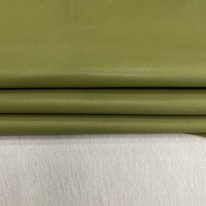 Heritage Goatskin Leather features a silky smooth texture and a refined finish. Available in rich shades of red, black, green, and purple, it offers durability and versatility for bold, sophisticated designs.