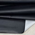 Bonded polyester satin with tricot backing, 58" wide, 0.3 mm thick. Available in Black, Champagne, Rose, Beige Copper, Bronze Red & Silver.