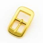Close-up of Y1018 Center Bar Buckle in Gold finish, made of zinc alloy, designed for straps. Compact, rectangular design with a center bar, photographed on a neutral background.