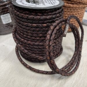 Premium braided vegetable-tanned leather cords in vintage tones. Available in 3mm & 6mm spools. Perfect for jewelry, bags, and artisan crafts.