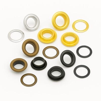 Four color variations of 14.5mm EL2 beveled grommets with matching washers in Antique Brass, Gold, Gunmetal, and Nickel finishes from Avetco.