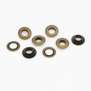 8.8mm beveled grommets EL2 in Antique Brass finish with matching washers on a white background.-Avetco