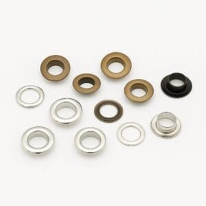 8.8mm EL2 beveled grommets in Antique Brass and Nickel finishes with matching washers, arranged on a white background.-Avetco