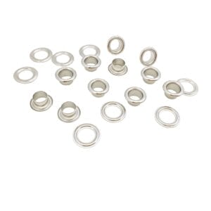 Nickel beveled grommets with washers laid out on a bright white surface for product display.-Avetco