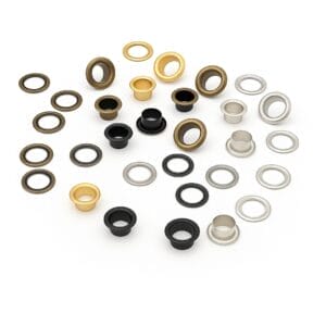 Assorted EL2 beveled grommets in four finishes—Antique Brass, Gold, Gunmetal, and Nickel—arranged in groups with matching washers on a white background. -Avetco