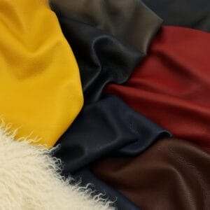Cobalt full grain cowhide leather with pebbled texture shown alongside color variations-Avetco