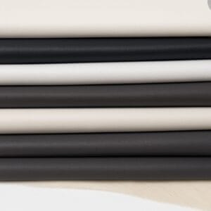 Milano cow leather in soft neutrals including Antique White, Black, White, Charcoal Gray, Whisper White, and Castlerock.- Avetco