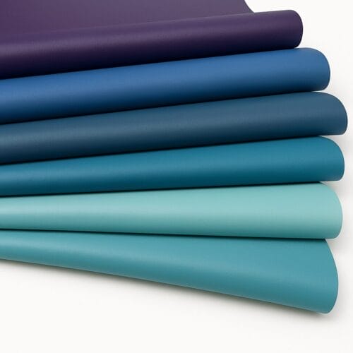 Draped lamb leather swatches in shades of blue and purple on a white background-Avetco