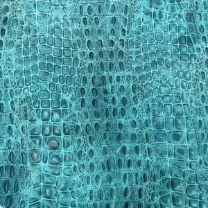 Oltu crocodile embossed cow leather hide in turquoise color. Avetco