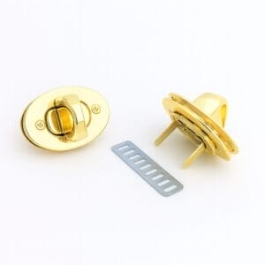 Gold oval twist lock closure for handbags with front and back view including prong plate, model Y1094, Avetco.