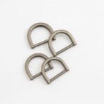AVETCO image showing four antique nickel D-rings with a brushed metallic finish.