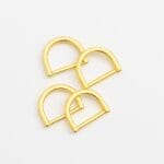 Four shiny gold AVETCO D-rings with a polished finish on a white background.
