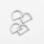 AVETCO image showing four polished nickel D-rings with a reflective surface.