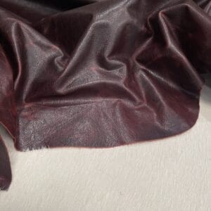 Bernard Oily Pull-Up Cowhide – Cordova Red drape highlighting pull-up tones