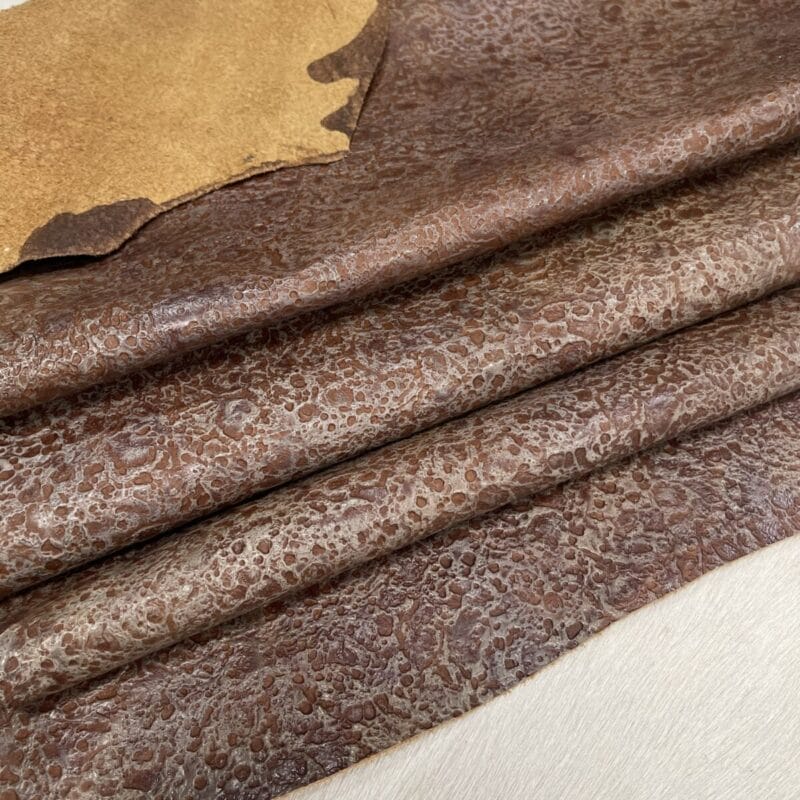 Rusted Terrain embossed cowhide – folded hide surface detail