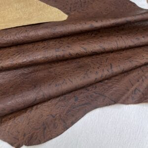 Flint Leaf embossed cowhide – folded hide surface detail