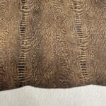 Fossil Spine embossed cow leather – tan hide with fossil texture