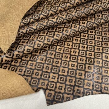 Ancestral Path embossed cowhide – folded hide with motif pattern