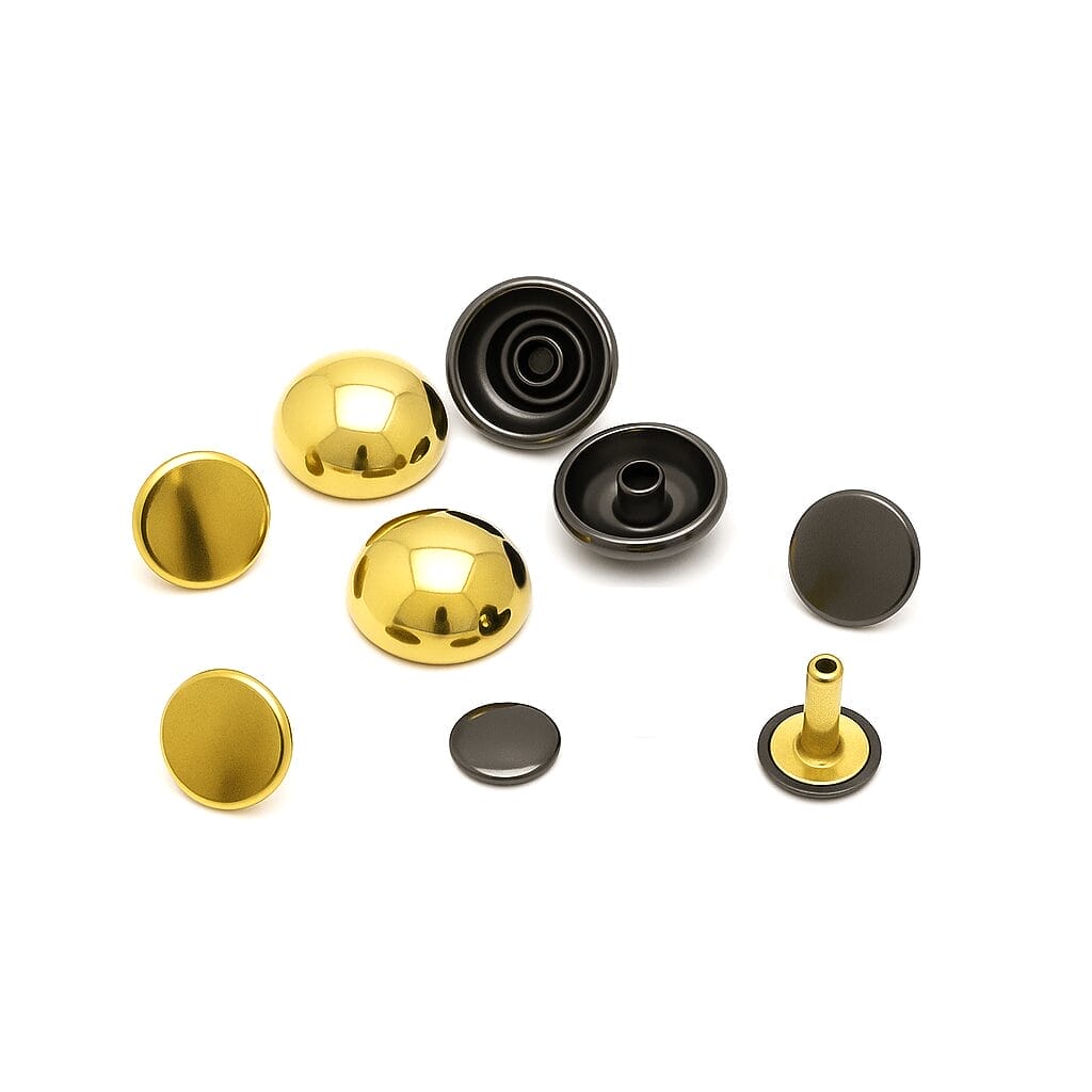 HPR588 gold and gunmetal 15-17.5mm Gold and gunmetal dome rivets displayed side by side on a white background, showcasing color variation and reflective metallic finishes.